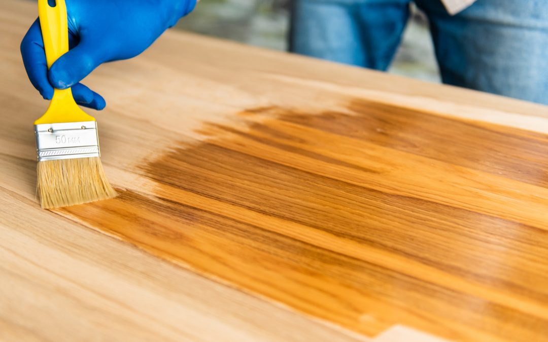 Worktop Refinishing in Greenwich on a solid oak hardwood kitchen worktop, with a professional applying protective oil for a smooth, hygienic surface.